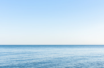 Sea background, quiet cozy calm cloudless morning on the sea coast