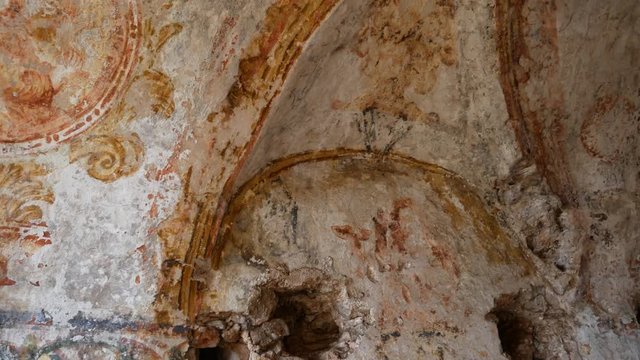 Apricena, Apulia, Italy - March 09 2019: ruins of Eremo of Sant'Agostino with traces of frescoes in the valley of the hermitages. Hermitages of Stignano in Gargano National Park