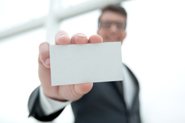 businessman showing a blank business card