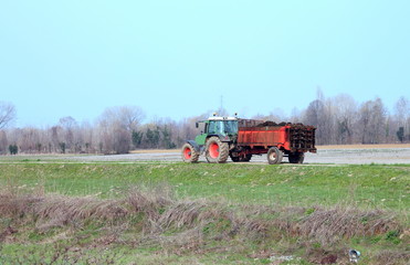tractor with a cart of manure