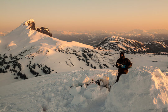 Man standing near igloo for camping in Garibaldi Provincial Park