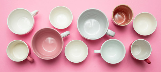 Empty coffee cups white and pink color against pink background, banner