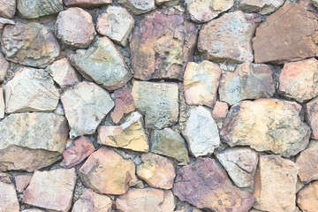 Seamless brown pattern of decorative grey slate stone wall surface of modern style design decorative uneven cracked realmasonry wall.