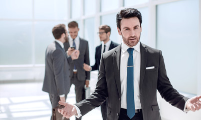 friendly businessman standing in the office.