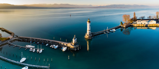 Aerial Panoramic view of Lindau Harbour and the Austrian Alps, Lake Constance - obrazy, fototapety, plakaty