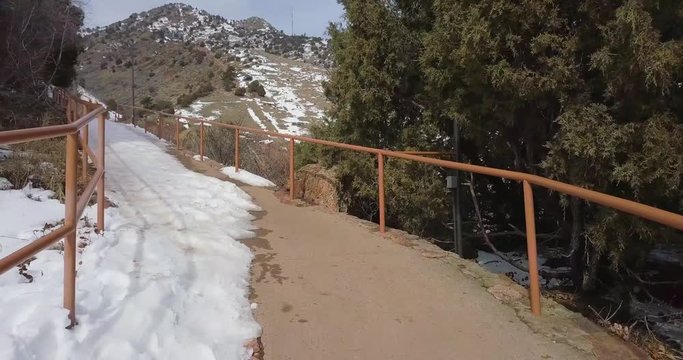 Smooth Gliding Shot Along Snowy Mountain Path