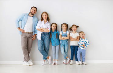large family mother father and children sons and daughters on white background.