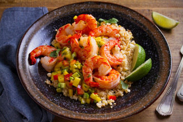 Shrimps with cauliflower, mango avocado, red paprika pepper and lime. horizontal