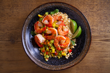 Shrimps with cauliflower, mango avocado, red paprika pepper and lime. overhead, horizontal