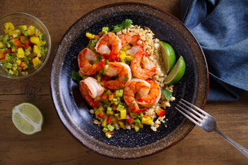 Shrimps with cauliflower, mango avocado, red paprika pepper and lime. overhead, horizontal