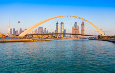 Dubai city skyline at sunset. view of Tolerance bridge
