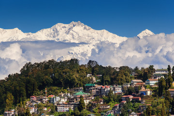 Fototapeta na wymiar Darjeeling and Kangchenjunga on the background. Kanchenjunga, is the third highest mountain in the world. Beautiful Himalayan landscape near Nepal and Sikkim. Indian Himalayas.