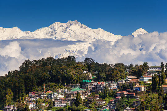 Darjeeling and Kangchenjunga on the background. Kanchenjunga, is the third highest mountain in the world. Beautiful Himalayan landscape near Nepal and Sikkim. Indian Himalayas.
