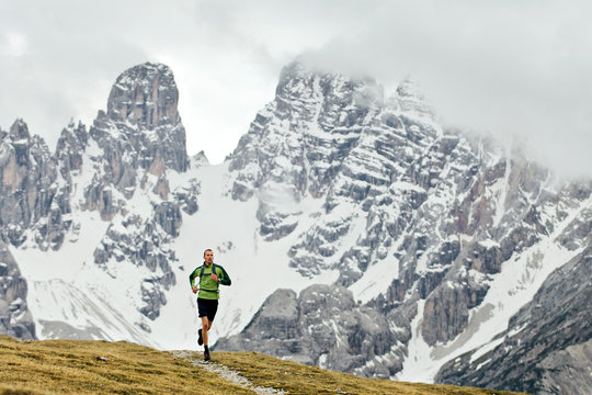 Man running on at Italian Dolomites