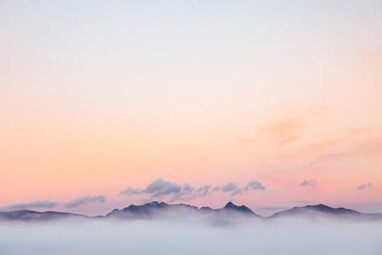 Lyell Range shrouded in clouds at dusk - Powered by Adobe