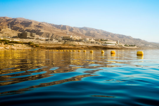 View from water of Dead Sea shoreline in Madaba Governorate, Jordan