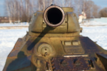 Old battle Tank on the snow, participated in the 2nd world war.