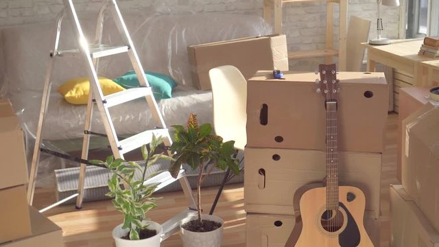 concept of the idea,an empty room with boxes for moving house,nobody
