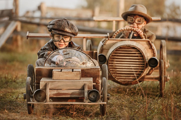 Competition between the two boys on improvised racing cars