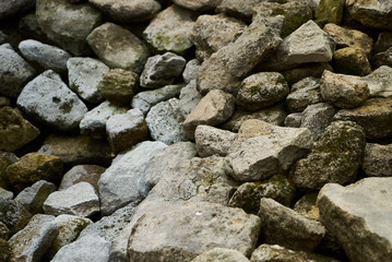 Old moss covered river stones background texture