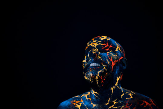 Man's  Face Painted in Neon UV Lava