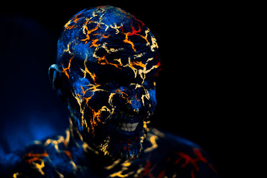 Man's  Face Painted in Neon UV Lava