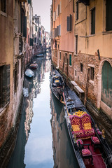 Fototapeta na wymiar Narrow and picturesque canals of Venice