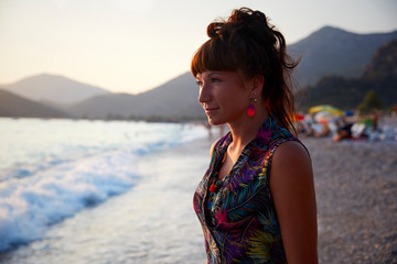 Portrait of woman on beach at sunset