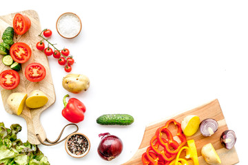 Vegan food cooking with raw vegetables on white background top view mock up