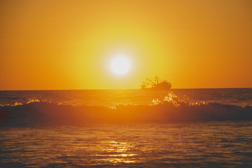 Floting boat at the sunset 