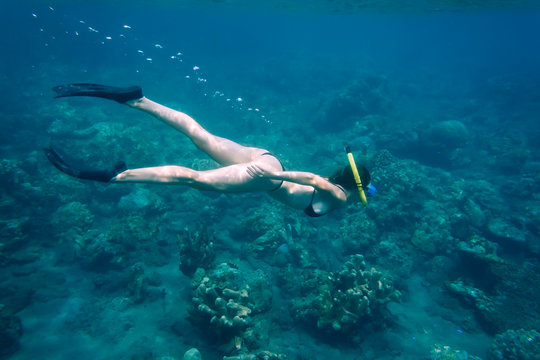Indonesia, Bali, young woman snorkeling