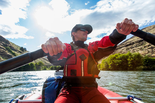 Man rowing on raft down Deschutes River