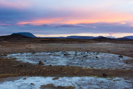 Blue coloured soil with orange coloured clound at Hverar ndor Hverir Geothermal Area, at Namaskard Pass in Iceland.