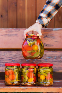 Fototapeta Close-up Of Woman Holding A Jar With Homemade Pickles