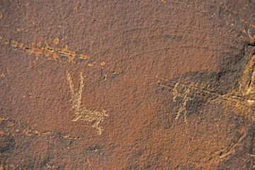 Rock Art scenes carved by the ancients on boulders in Utah.