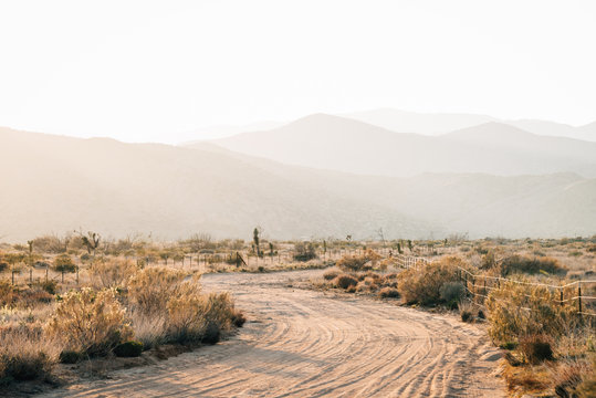 Dirt road and mountains at sunset, in Pioneertown, California