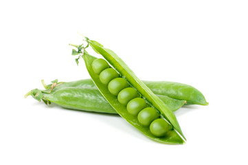 green peas in pods on a white background