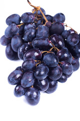 Ripe sweet grapes on white background