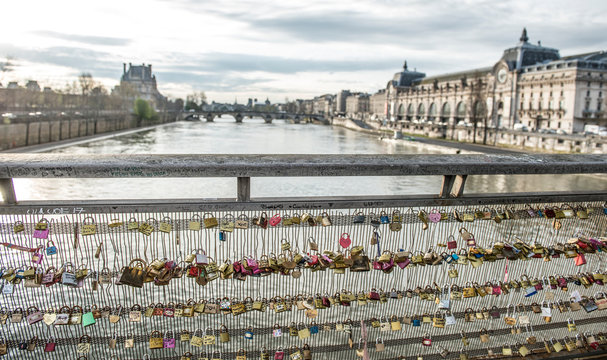 Love padlocks on bridge over Seine River, Paris, France