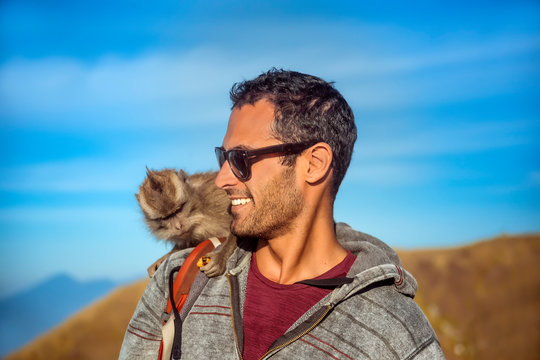 Man with monkey on shoulder, Mount Batur, Bali, Indonesia