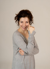 Obraz premium Portrait of young attractive woman with happy and smiling face. In posing and modeling concept