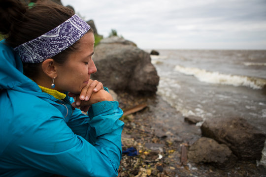A woman becomes emotional upon reaching the shore of the Okhotsk Sea in far east Russia.