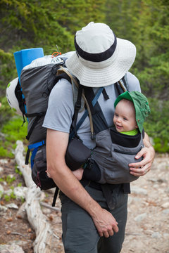 A man hikes with his baby daughter on the Ypsilon Lake Trail, Rocky Mountain National Park, Colorado.