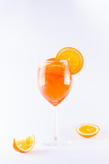 Cocktail aperol spritz on white background. Summer alcoholic cocktail with orange slices. Italian cocktail aperol spritz on white. Isolated