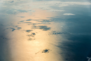 Top view of white clouds above the water