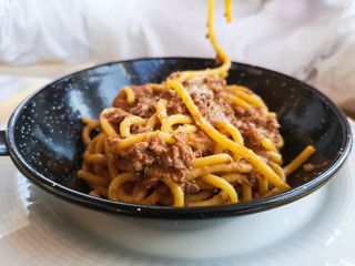 Spaghetti with meat ragu served directly in the pan.