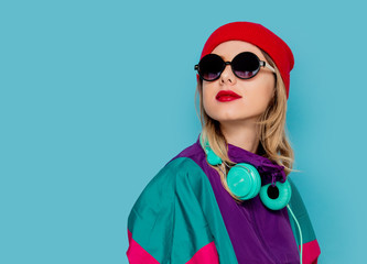woman in red hat, sunglasses and suit of 90s with headphones