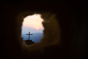 Empty tomb with cross symbol for Jesus Christ is risen