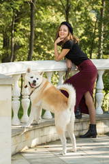 The girl in beret and skirt in the park	