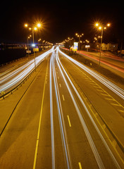 Motion picture in Kiev at night in the sunset. Kind of traffic on a busy street at sunset - the image has soft focus.